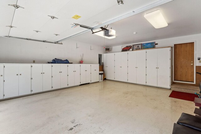 99 Golf Ter, Bigfork, MT 59911 - garage featuring a garage door opener