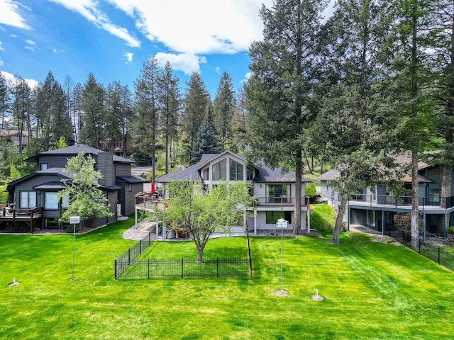 99 Golf Ter, Bigfork, MT 59911 - back of property featuring a wooden deck