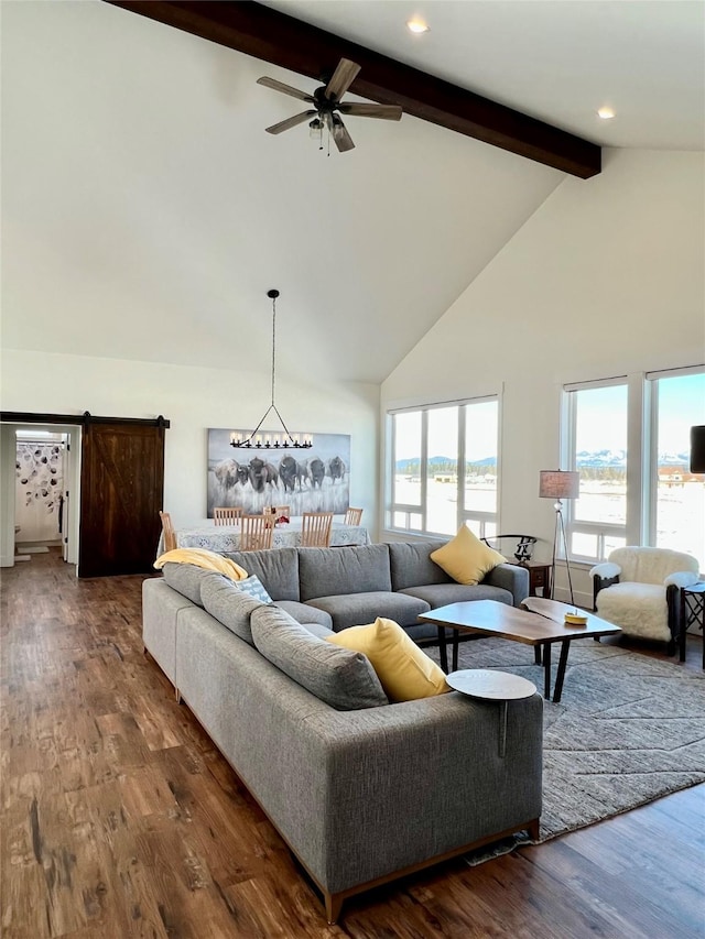 living area featuring ceiling fan, beam ceiling, high vaulted ceiling, and wood finished floors