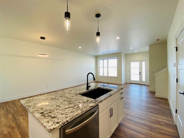 kitchen featuring dishwasher, open floor plan, a sink, and dark wood-style floors