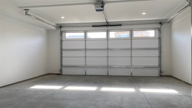 garage with a garage door opener and baseboards