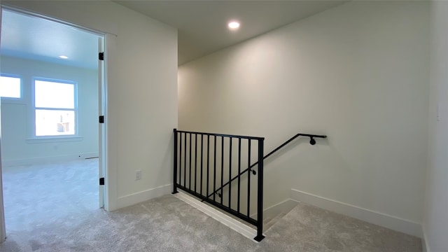 stairway featuring carpet, baseboards, and recessed lighting