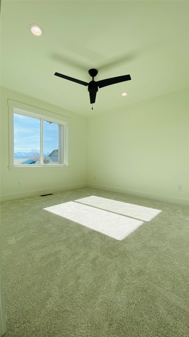 empty room with ceiling fan, baseboards, carpet flooring, and recessed lighting