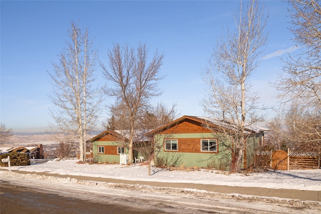 view of front of home featuring fence