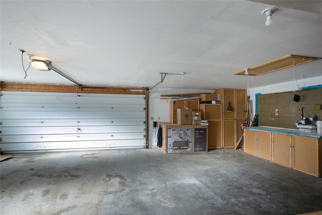 garage featuring a workshop area and a garage door opener