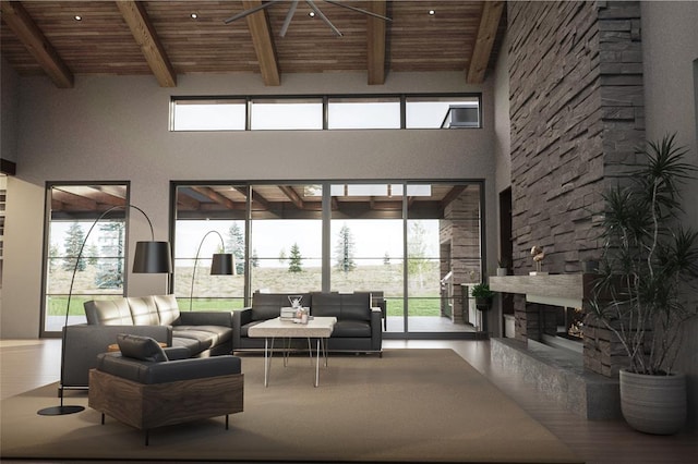 9520 Royal Coachman Dr Lot 13, Missoula, MT 59808 - living room with a wooden ceiling with exposed beams, a fireplace, a towering ceiling, and healthy amount of natural light