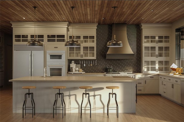 9520 Royal Coachman Dr Lot 13, Missoula, MT 59808 - kitchen with built in fridge, light wood finished floors, wooden ceiling, glass insert cabinets, and white double oven