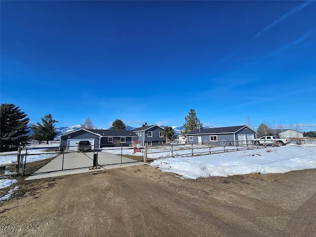 view of front of house with a fenced front yard and a gate