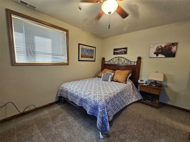 bedroom featuring baseboards, visible vents, ceiling fan, and carpet flooring