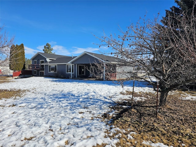 view of snow covered house