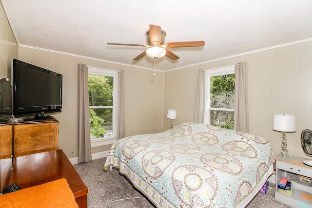 bedroom with a ceiling fan, multiple windows, and crown molding