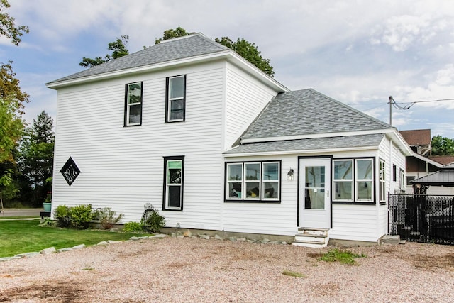 view of front of home featuring entry steps and roof with shingles