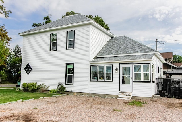 view of front of home featuring roof with shingles, entry steps, and a gazebo