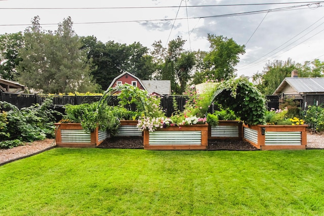 view of yard with a garden and fence