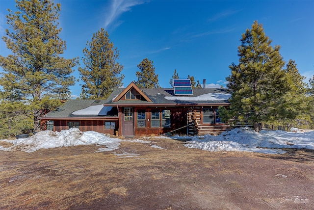 view of front of property with solar panels