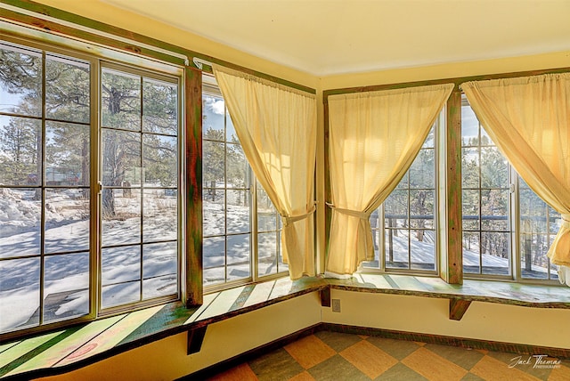 unfurnished sunroom with plenty of natural light