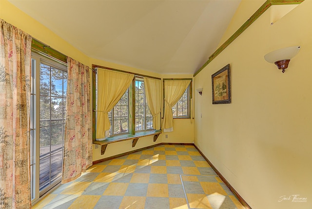 6220 Elkhorn Rd, Helena, MT 59602 - spare room with baseboards and vaulted ceiling