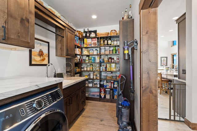 75 Meadows Dr, Whitefish, MT 59937 - washroom with washer / clothes dryer, cabinet space, recessed lighting, and light wood-style flooring