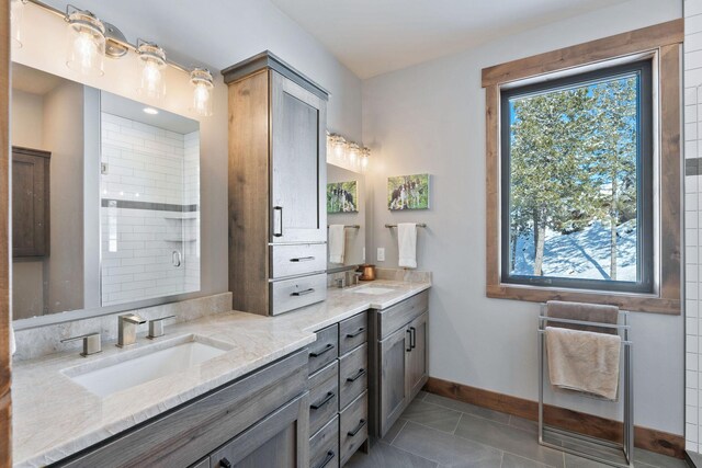 75 Meadows Dr, Whitefish, MT 59937 - full bathroom featuring double vanity, a shower stall, and tile patterned floors