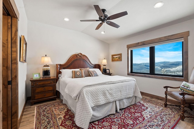 75 Meadows Dr, Whitefish, MT 59937 - bedroom featuring vaulted ceiling, light wood finished floors, recessed lighting, and a ceiling fan
