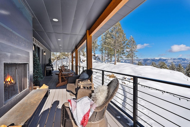 75 Meadows Dr, Whitefish, MT 59937 - snow covered deck with a lit fireplace