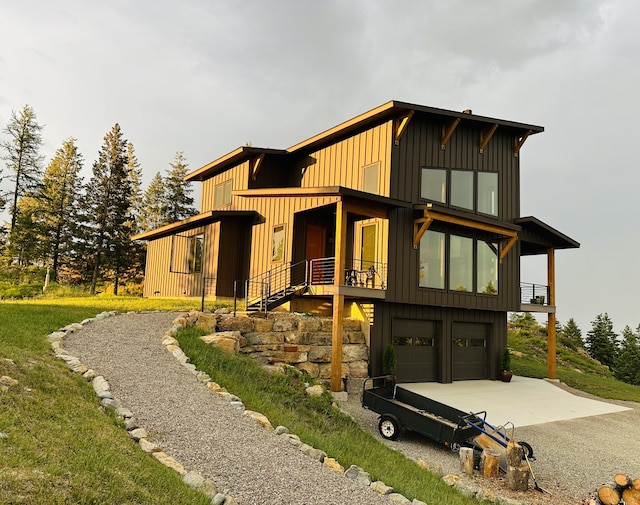 75 Meadows Dr, Whitefish, MT 59937 - modern home featuring driveway, board and batten siding, and a garage