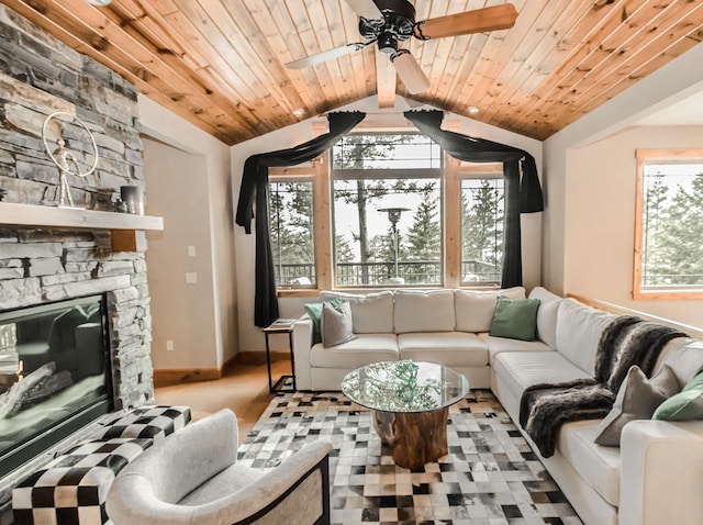 living area with vaulted ceiling, a fireplace, wood ceiling, and baseboards