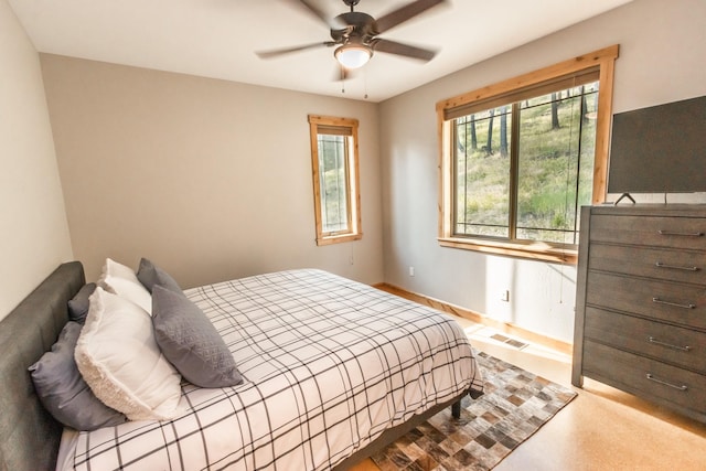 bedroom with visible vents and a ceiling fan