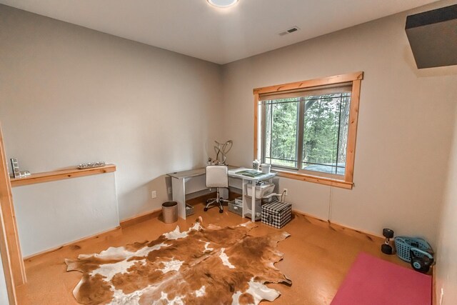 unfurnished room featuring carpet and visible vents