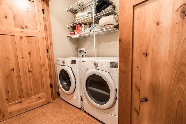 laundry area featuring laundry area, tile patterned floors, and independent washer and dryer