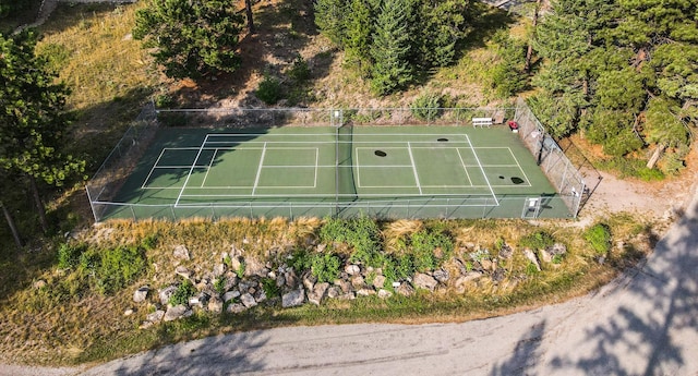 view of sport court with fence