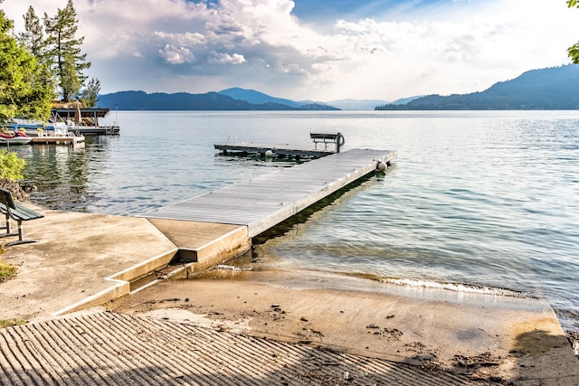 dock area with a water and mountain view