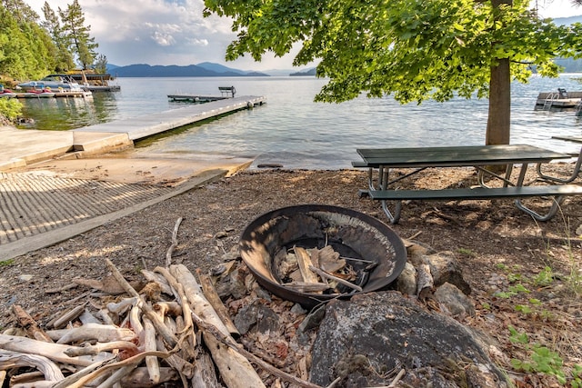 dock area featuring a water and mountain view