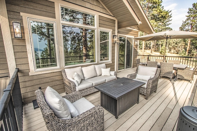 wooden terrace featuring an outdoor hangout area and outdoor dining space