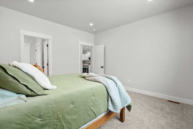 bedroom with carpet floors, visible vents, baseboards, and recessed lighting