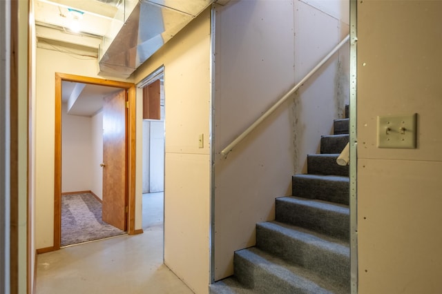 stairway with concrete floors