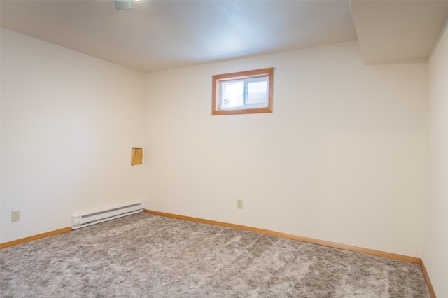 carpeted empty room featuring baseboards and baseboard heating