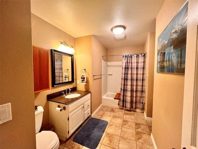 bathroom featuring baseboards, toilet, vanity, shower / bath combination with curtain, and a textured ceiling