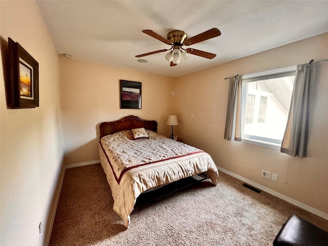 bedroom with visible vents, baseboards, and carpet flooring