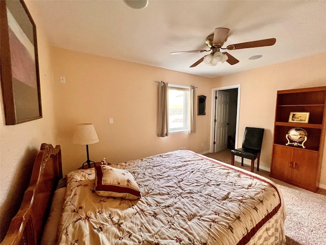 bedroom with baseboards, carpet floors, and ceiling fan