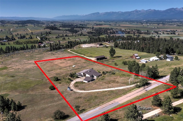 aerial view with a mountain view and a rural view