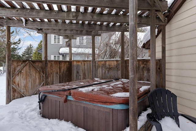 exterior space with a hot tub and fence