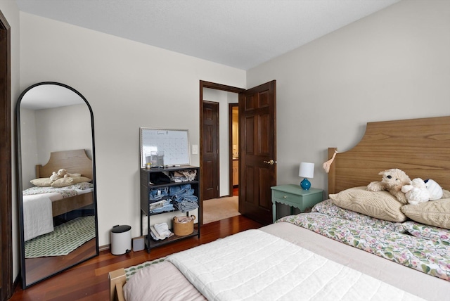 bedroom with wood finished floors