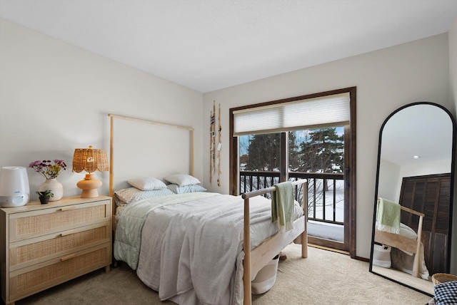 carpeted bedroom with access to outside