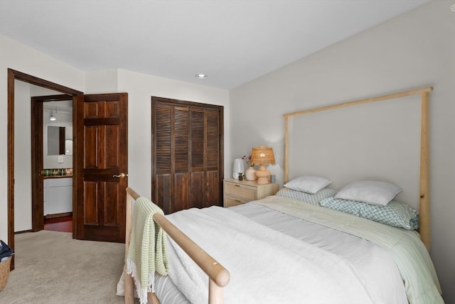 bedroom with carpet and a closet