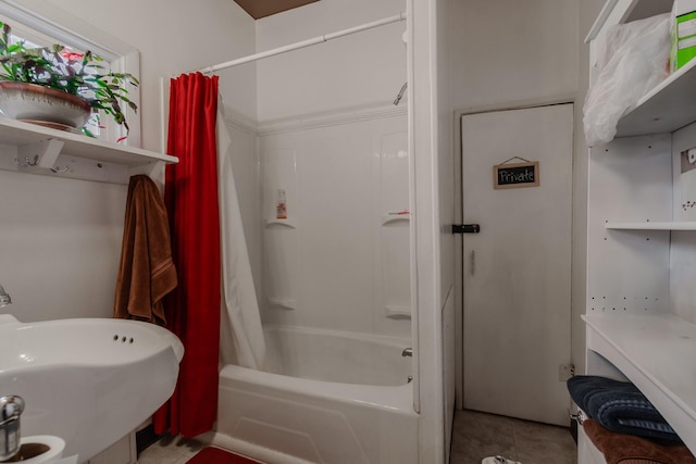 full bath with shower / bath combination with curtain, tile patterned flooring, and a sink