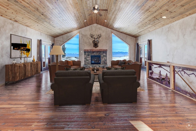 3 Paradise Ridge Rd, Clancy, MT 59634 - living area featuring vaulted ceiling, wood ceiling, wood-type flooring, a stone fireplace, and a ceiling fan