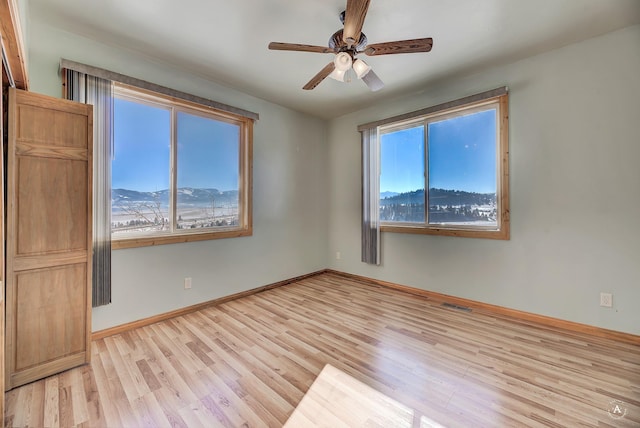 3 Paradise Ridge Rd, Clancy, MT 59634 - unfurnished room with light wood finished floors, a ceiling fan, and baseboards