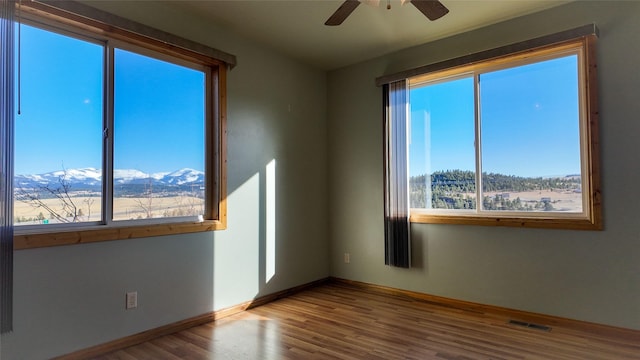 3 Paradise Ridge Rd, Clancy, MT 59634 - unfurnished room featuring ceiling fan, wood finished floors, and baseboards