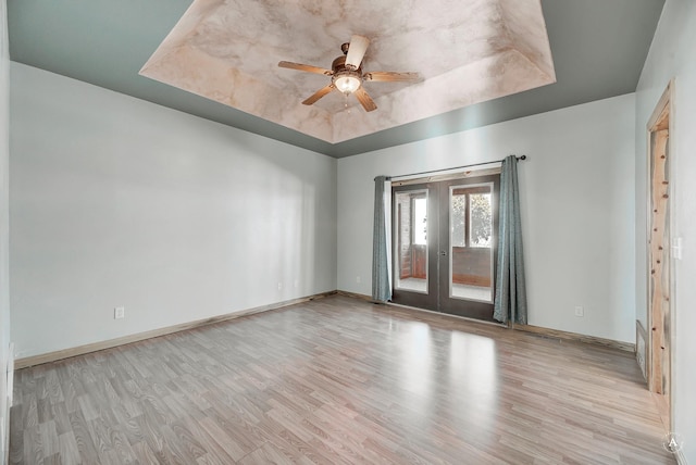 3 Paradise Ridge Rd, Clancy, MT 59634 - spare room with a raised ceiling, wood finished floors, french doors, and ceiling fan